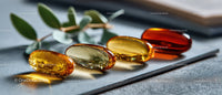 Colorful Gel Capsules on Gray Surface for Health and Wellness