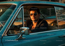 Stylish Man in Sunglasses Sitting in Classic Vintage Car at Sunset