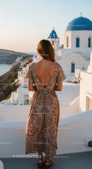Woman enjoying sunset view in Santorini Greece