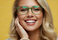 Close up of smiling woman wearing green eyeglasses