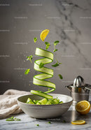 Fresh cucumber ribbons with lemon and mint in ceramic bowl