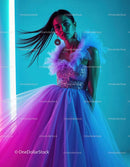 Vibrant Woman in Glittering Tulle Dress with Artistic Neon Lighting