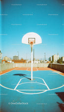 Urban Rooftop Basketball Court Under Clear Blue Sky