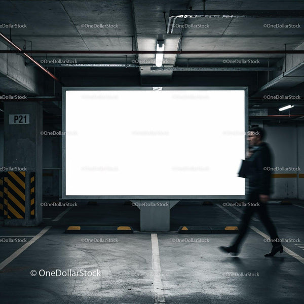 Blurred person walking past blank illuminated billboard JPG Mockup Image