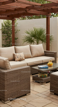 Elegant Outdoor Patio with Wicker Furniture and Lush Greenery