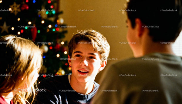 Teenagers enjoying conversation by decorated Christmas tree
