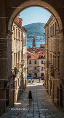 Historic Mediterranean Cityscape with Waterfront View and Red Tiled Roofs