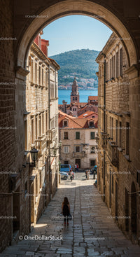 Historic Mediterranean Cityscape with Waterfront View and Red Tiled Roofs