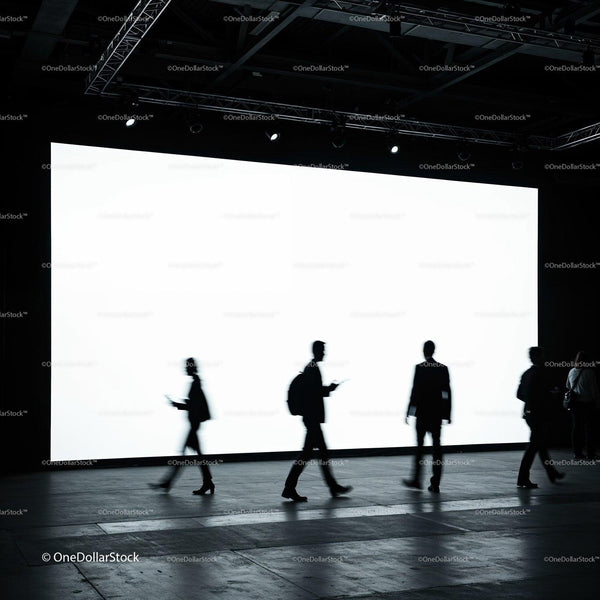 Silhouettes of people walking in front of bright screen JPG Mockup Image