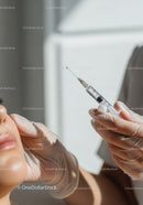 Healthcare Professional Administering Vaccination with Syringe in Medical Setting