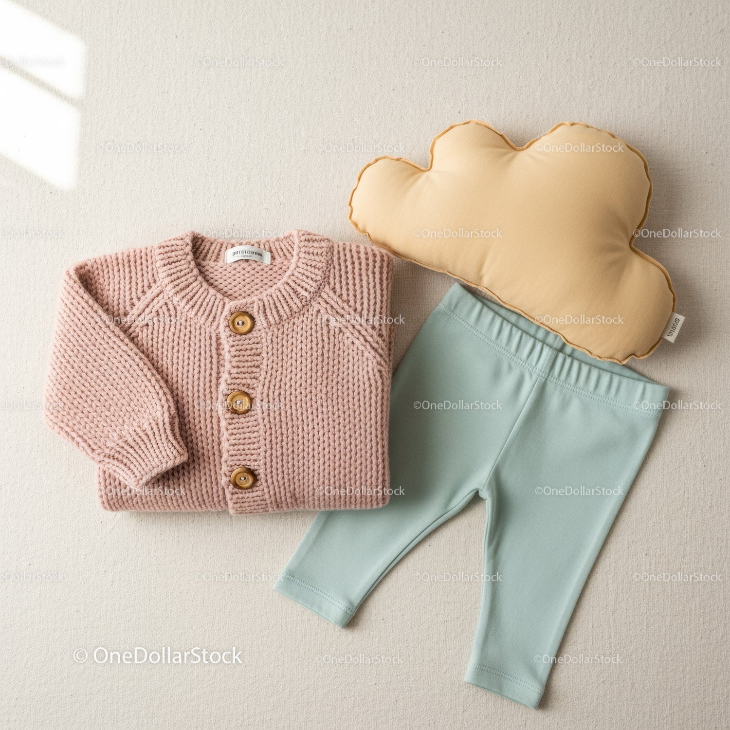 Cozy baby knit cardigan with soft leggings and pillow