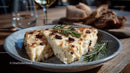 Gourmet Baked Cheese with Rosemary on Rustic Plate