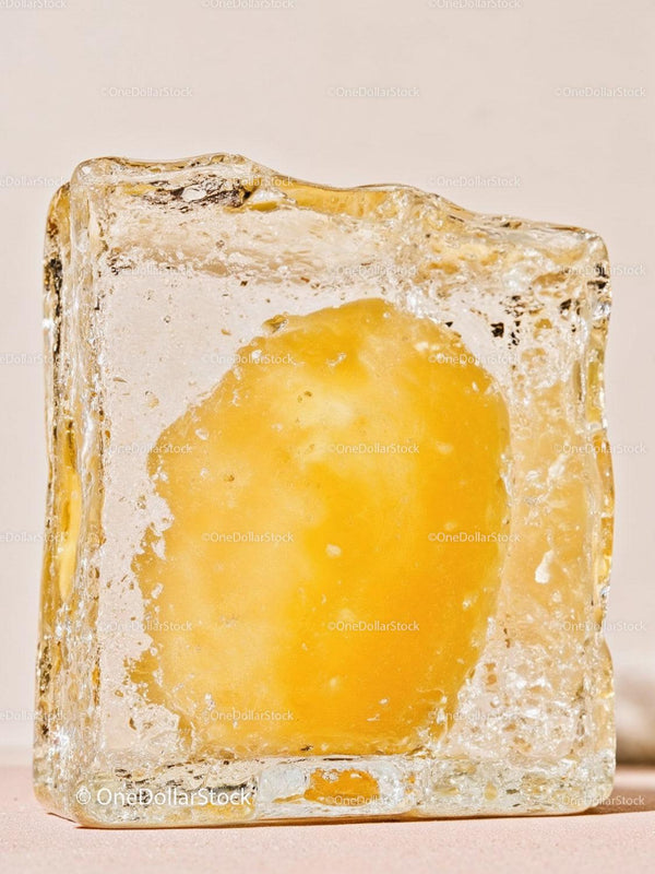 Frozen Lemon Enclosed in Transparent Ice Cube