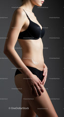 Elegant Woman in Black Lingerie with Graceful Pose in Studio