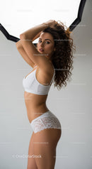Elegant Woman in White Lace Lingerie With Confident Pose