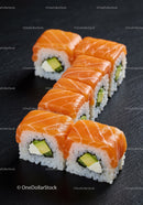 Fresh salmon sushi rolls with avocado and cream cheese