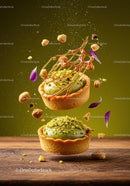 Two pistachio tarts with caramel and flower petals