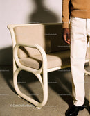 Man standing next to retro beige bench in casual outfit
