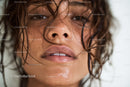 Close-up of Wet-Haired Woman with Moisture Droplets and Expressive Eyes