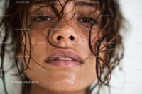 Close-up of Wet-Haired Woman with Moisture Droplets and Expressive Eyes
