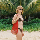 Woman in Bikini with Red Tote Bag on Tropical Beach with Palm Trees