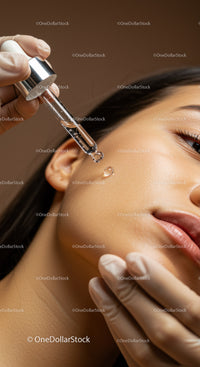 Close-Up of Woman Receiving Serum Application Treatment with Dropper