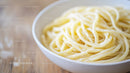 Close-up of Cooked Spaghetti Noodles in White Bowl