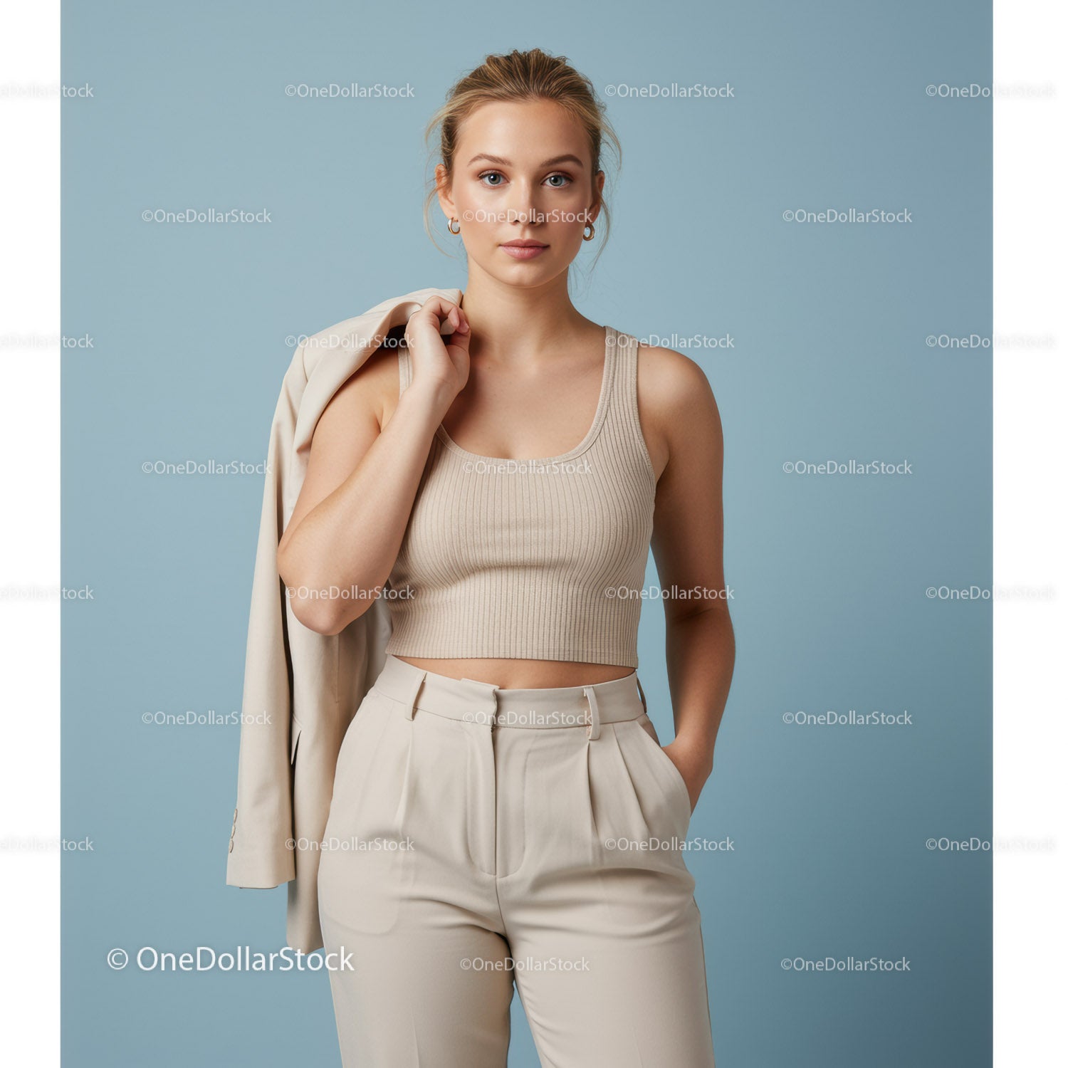 Stylish Young Woman in Beige Tank Top and High-Waisted Pants