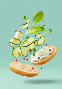 Fresh cucumber and cream cheese sandwich ingredients floating