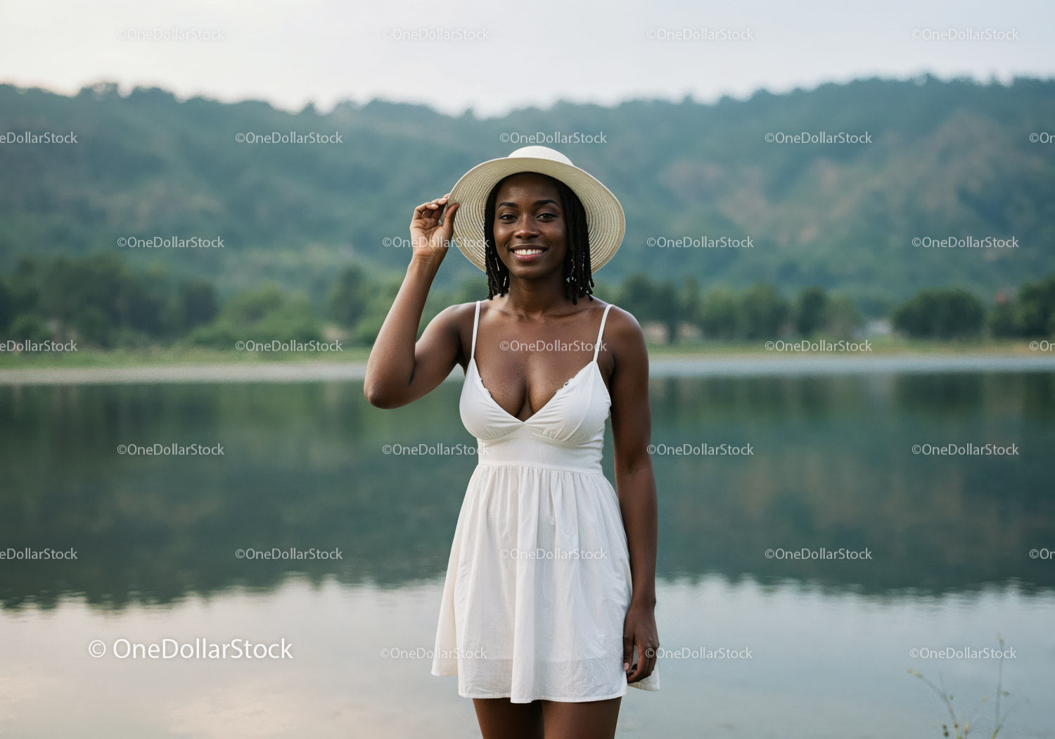 Beautiful Woman in White Dress with Wide-Brim Hat by Lake