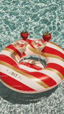 Pool Float with Champagne Glasses and Strawberries for Summer Relaxation