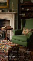 Cozy green armchair with patterned cushion by fireplace