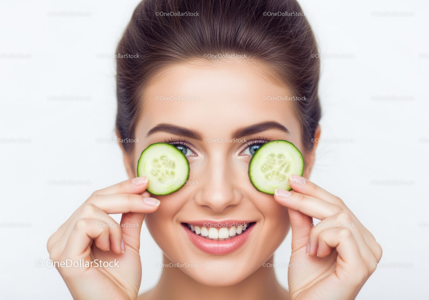 Young Woman Holding Cucumber Slices for Skincare and Beauty