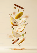 Fresh sliced pears with cinnamon and pistachios floating
