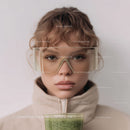 Girl with Curly Red Hair Wearing Glasses Holding Green Smoothie