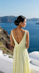 Woman in Yellow Dress Enjoying Scenic Ocean View