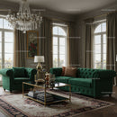 Elegant Living Room with Green Velvet Sofas and Crystal Chandelier