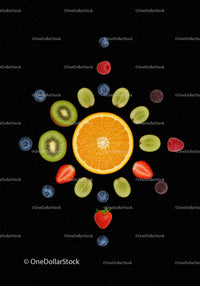 Fresh mixed fruits arranged on black background