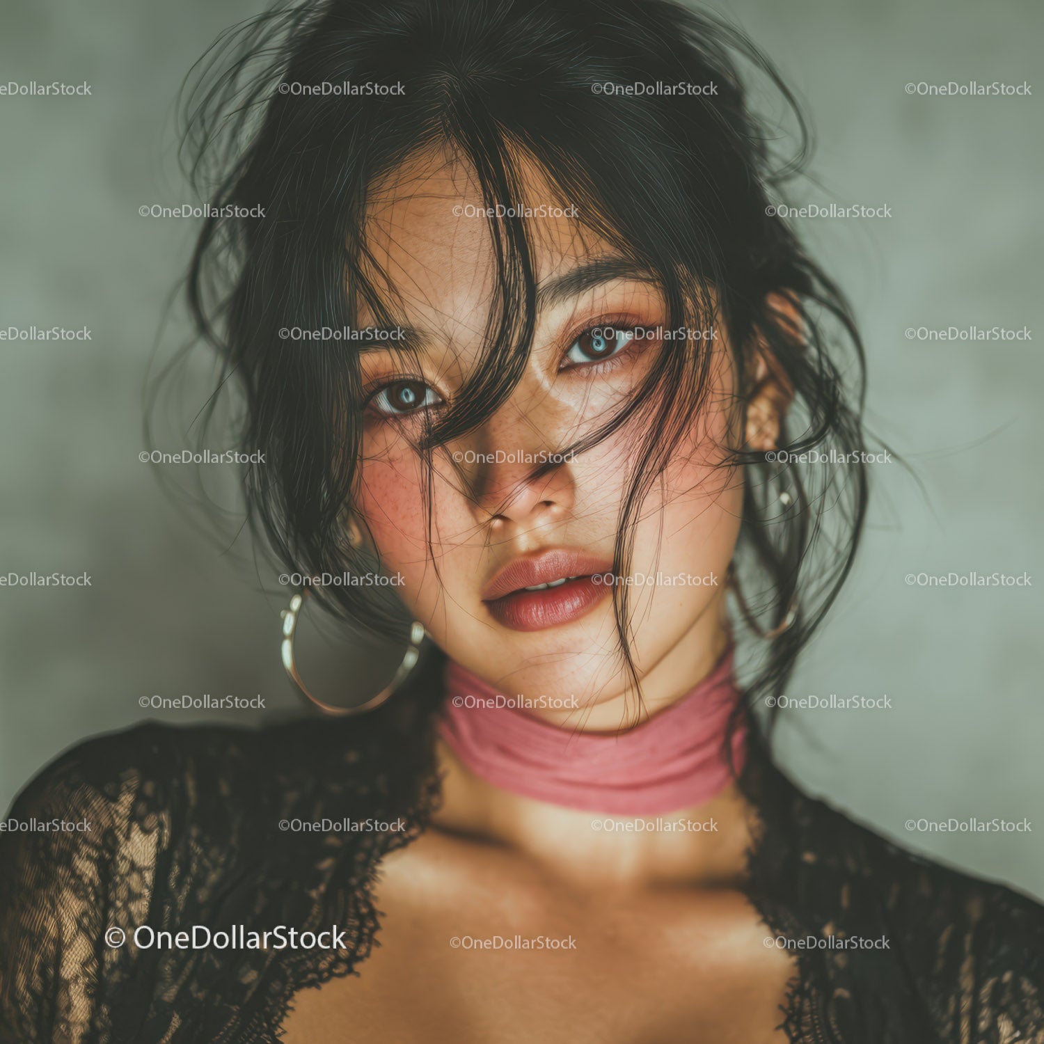 Close-Up of a Woman with Dark Hair and Golden Jewelry in Glamorous Style