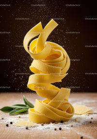 Close up of fresh fettuccine pasta with flour dust