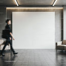 Blurred Woman Walking Past Modern Minimalist Lobby Wall
