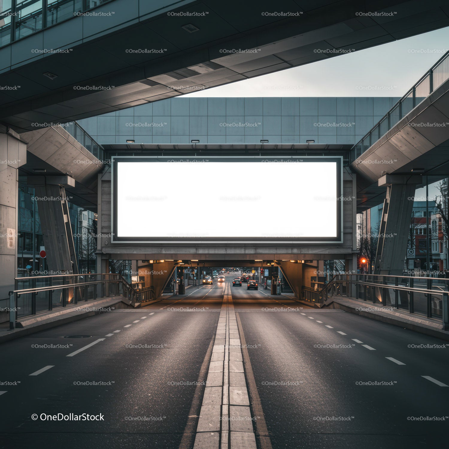 Empty Urban Road beneath Large Illuminated Billboard