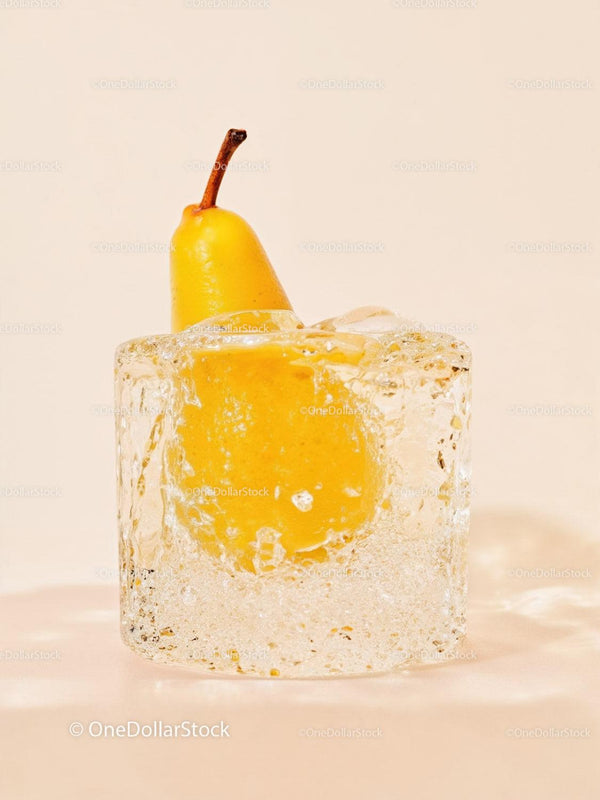 Fresh Yellow Pear Frozen Inside Transparent Ice Cube