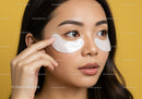 Close-up of Woman Applying Under Eye Patches for Skincare Treatment
