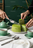 Green Tea Layer Cake Slices on Elegant Table with Teapot