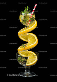 Fresh Lemon Spiral with Herb Infused Drink in Glasses