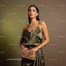 Elegant Woman Wearing Satin Dress and Gold Accessories