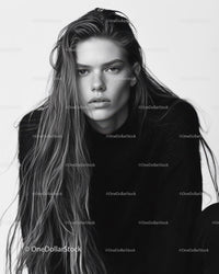 Monochrome Portrait of Female Model with Long Hair and Confident Expression