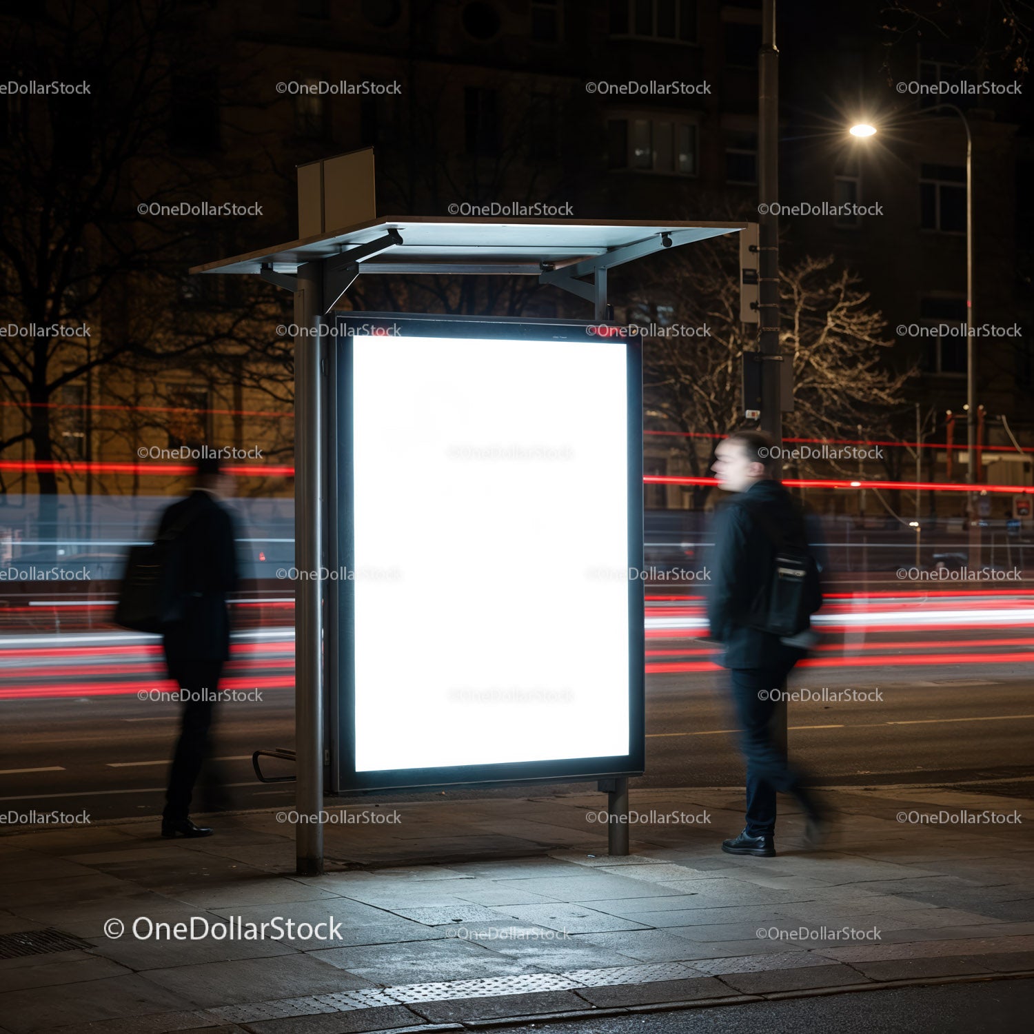 Illuminated Bus Stop Advertisement at Night in City