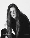 Black and White Portrait of Young Woman with Wet Hair and Intense Gaze